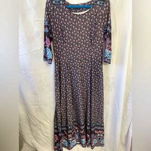 Patterned Reborn dress with pockets, women’s size large.
